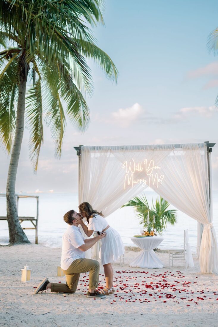 Sunset marriage proposal under a white canopy on Bounty Beach, Punta Cana
