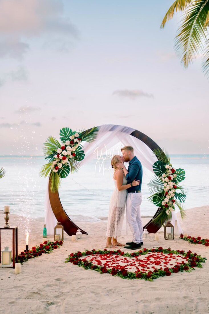 Tropical arch marriage proposal setup on the beach in Punta Cana, Dominican Republic