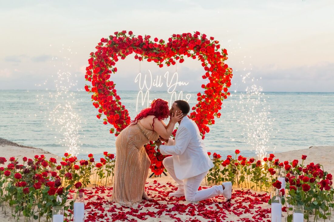 VIP marriage proposal in Punta Cana with a red rose heart arch and beach fireworks send-off